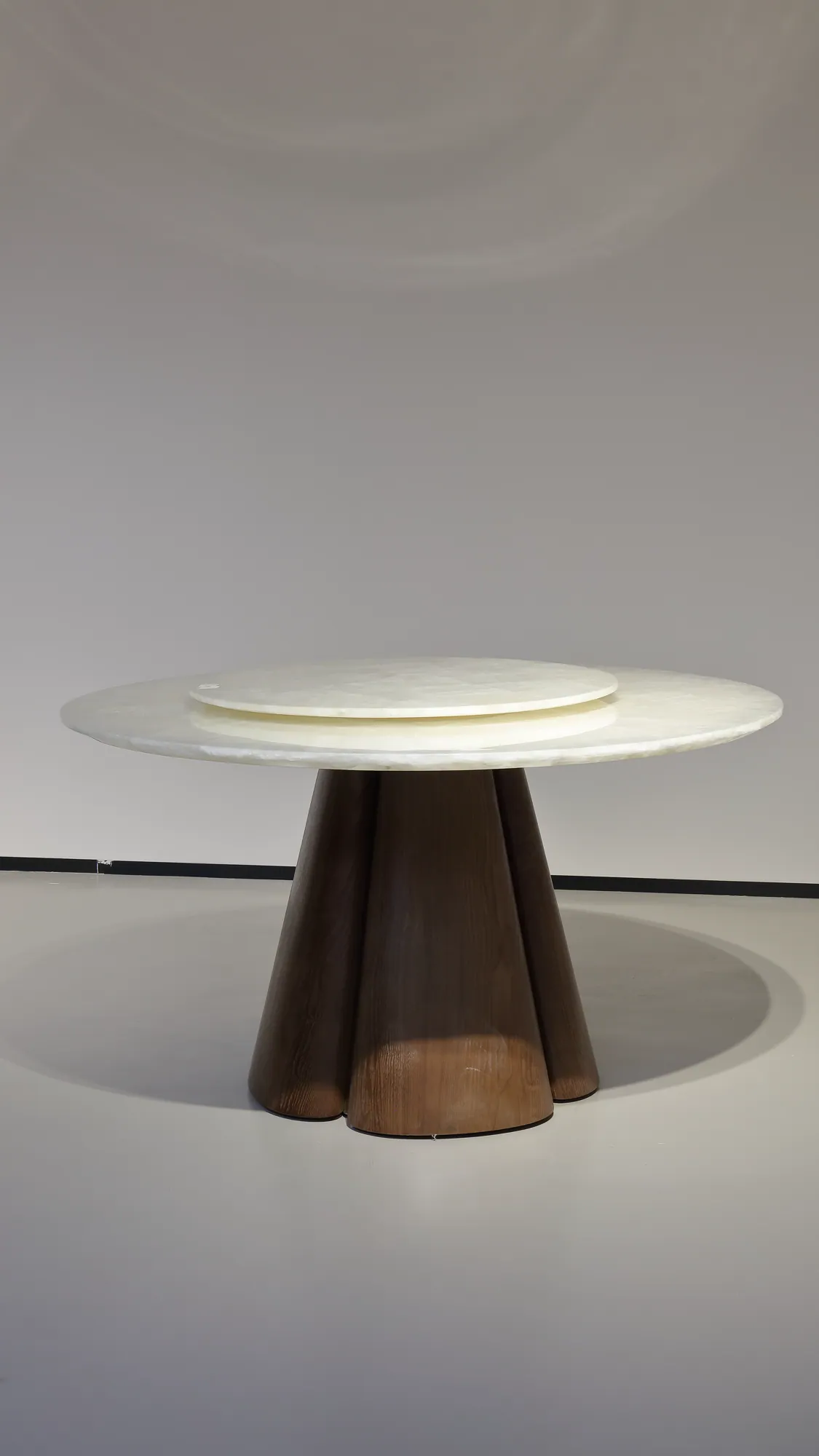 Ice Age round natural-stone dining table